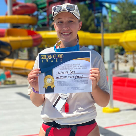 Lifeguard receiving golden guard award